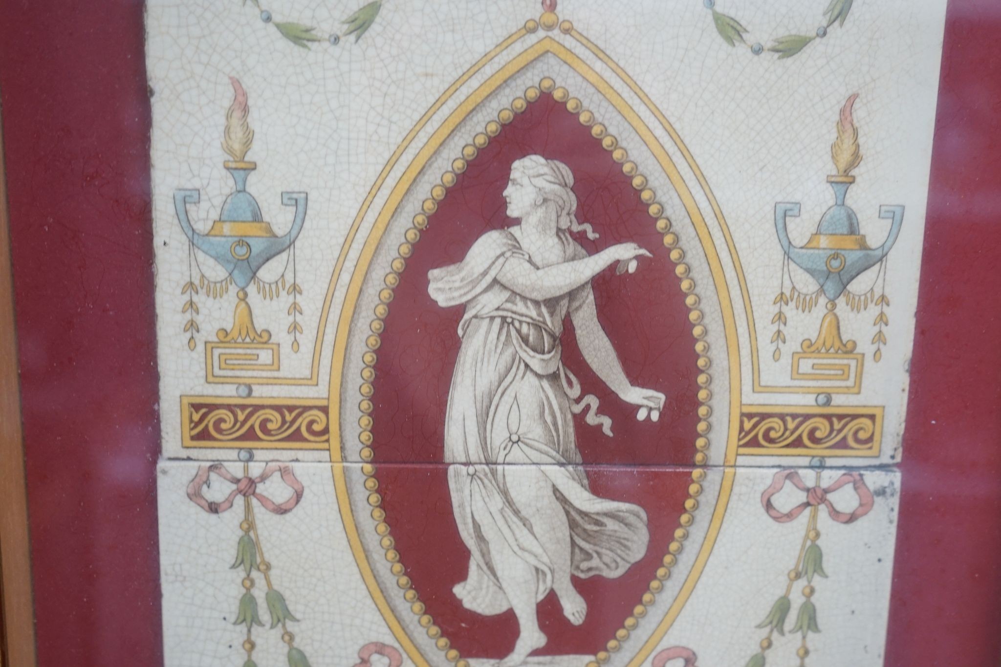 A late 19th century twin-tile panel, framed, tiles 20cm square